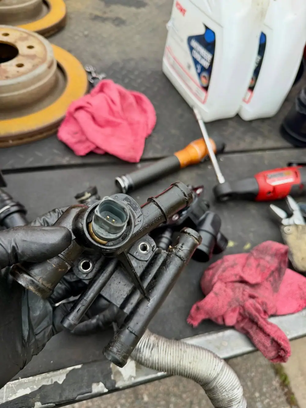 Thermostat housing off during a cooling system repair