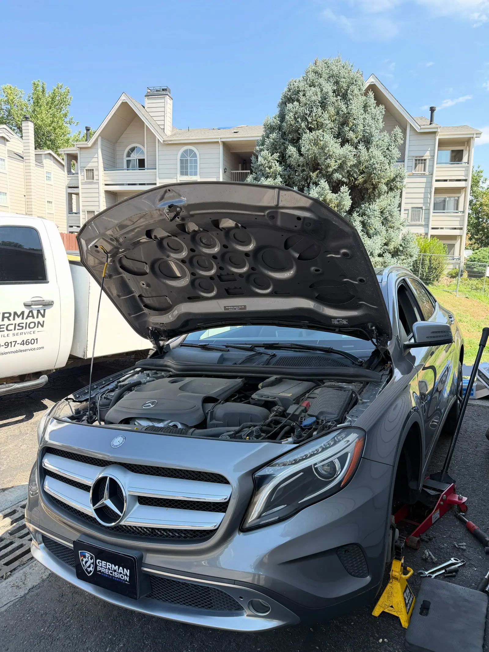 Service truck beside a Mercedes GLA on location in Denver